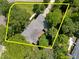 Aerial view of the property showing the home surrounded by mature trees at 116 Lost Tree Ln, Cary, NC 27513