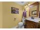 Well-maintained half-bathroom with stylish fixtures, decorative mirror, and elegant vanity at 116 Lost Tree Ln, Cary, NC 27513