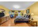 Bright bedroom featuring wood floors, traditional furnishings, and natural light at 116 Lost Tree Ln, Cary, NC 27513