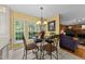 Cozy breakfast nook with natural light, adjacent to the open living room with a fireplace at 116 Lost Tree Ln, Cary, NC 27513