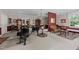 Spacious living room with a grand piano, stylish decor, and comfortable seating areas at 116 Lost Tree Ln, Cary, NC 27513