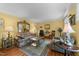 Cozy living room with vintage furniture, ornate mirror, and hardwood floors at 116 Lost Tree Ln, Cary, NC 27513