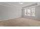 Spacious primary bedroom with tray ceiling and natural light at 1172 Pemberly Ave, Morrisville, NC 27560