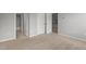 Bedroom with neutral walls and carpet, multiple doors and trim throughout at 1172 Pemberly Ave, Morrisville, NC 27560