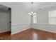 Dining room with hardwood floors and modern lighting fixture at 1172 Pemberly Ave, Morrisville, NC 27560
