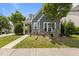 Charming home with blue siding, stone accents, inviting front entrance, and well-kept lawn at 1172 Pemberly Ave, Morrisville, NC 27560