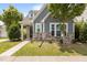 Charming home exterior with stone accents, gray shingles and a inviting front entrance at 1172 Pemberly Ave, Morrisville, NC 27560