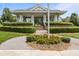 Beautifully landscaped gazebo featuring an open-air design and manicured bushes with seasonal flowers at 1172 Pemberly Ave, Morrisville, NC 27560