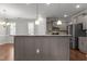 Kitchen with large island, granite countertops, stainless steel appliances, and pendant lighting at 1172 Pemberly Ave, Morrisville, NC 27560