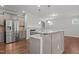 Spacious kitchen featuring granite countertops, stainless steel appliances, and hardwood floors at 1172 Pemberly Ave, Morrisville, NC 27560