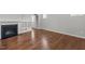 Living room features hardwood floors, fireplace, and built-in shelving for storage at 1172 Pemberly Ave, Morrisville, NC 27560
