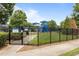 Community playground with slides, swings, and a fenced perimeter for added safety at 1172 Pemberly Ave, Morrisville, NC 27560