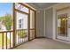 Enclosed porch features wood screens and a door leading to the backyard at 1172 Pemberly Ave, Morrisville, NC 27560