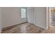 Comfortable bedroom features hardwood floors, a window with natural light, and closet at 1302 Valley Run Dr, Durham, NC 27707