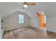 Charming bedroom featuring unique wallpaper, a ceiling fan, and wood-look flooring at 1302 Valley Run Dr, Durham, NC 27707