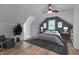 Cozy bedroom with hardwood floors, sloped ceilings, and a neutral color palette at 1302 Valley Run Dr, Durham, NC 27707
