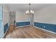 Spacious dining room featuring hardwood floors, modern lighting, and natural light at 1302 Valley Run Dr, Durham, NC 27707