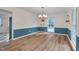 Inviting dining room with stylish lighting, floating shelves, and wainscoting at 1302 Valley Run Dr, Durham, NC 27707