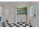 Convenient laundry area in hallway with washer, dryer, shelving, and extra storage space at 1302 Valley Run Dr, Durham, NC 27707