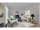 Bright living room with fireplace, neutral decor, and stylish furniture at 1302 Valley Run Dr, Durham, NC 27707