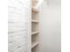 An empty closet showcasing shelves providing the perfect space for storage and organization at 1401 Robinhood Rd, Durham, NC 27701