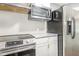 A kitchen showcasing stainless steel appliances and white cabinets at 1401 Robinhood Rd, Durham, NC 27701