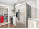 A kitchen showcasing stainless steel appliances and a view into the laundry area at 1401 Robinhood Rd, Durham, NC 27701
