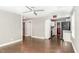Spacious living room leading into the kitchen featuring sleek, dark hardwood floors at 1401 Robinhood Rd, Durham, NC 27701