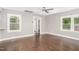 Bright living room with dark hardwood floors, neutral walls, and natural light at 1401 Robinhood Rd, Durham, NC 27701
