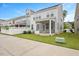 Well-maintained backyard featuring a screened porch and lush greenery at 1416 Southpoint Trl, Durham, NC 27713