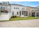 Backyard featuring a screened porch, lush greenery, and a white fence at 1416 Southpoint Trl, Durham, NC 27713