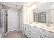 Modern bathroom with dual sink vanity, large mirror and glass enclosed walk-in shower at 1416 Southpoint Trl, Durham, NC 27713