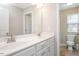 Bright bathroom with double sink vanity and tiled floors at 1416 Southpoint Trl, Durham, NC 27713
