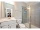 Bathroom with a framed glass shower, single vanity, and white toilet at 1416 Southpoint Trl, Durham, NC 27713
