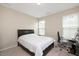 Cozy bedroom featuring neutral walls, carpet flooring, a bed, and a window with blind at 1416 Southpoint Trl, Durham, NC 27713