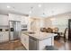 Well-equipped kitchen with white cabinetry and an island sink at 1416 Southpoint Trl, Durham, NC 27713