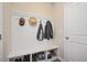 Mudroom featuring built-in bench with storage shelves below and hooks on the wall at 1416 Southpoint Trl, Durham, NC 27713