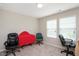 Home office featuring neutral walls, carpet flooring, and two windows with blinds at 1416 Southpoint Trl, Durham, NC 27713