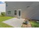 Back exterior showcasing a patio, siding, and a small garden area, perfect for outdoor relaxation at 160 Chandler Springs Dr, Holly Springs, NC 27540