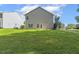 This beautiful backyard provides ample green space with a neatly kept lawn and convenient access to outdoor enjoyment at 160 Chandler Springs Dr, Holly Springs, NC 27540