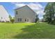 The backyard features a lush lawn, offering a serene outdoor space with easy access to walking path and nearby amenities at 160 Chandler Springs Dr, Holly Springs, NC 27540