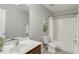 Clean bathroom features a vanity with sink, toilet, and a shower-tub combination with curtain at 160 Chandler Springs Dr, Holly Springs, NC 27540