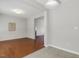 Dining area with hardwood floors, view into living room with fireplace at 160 Chandler Springs Dr, Holly Springs, NC 27540
