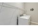 Laundry room featuring a washer, dryer, and wire shelving for storage at 160 Chandler Springs Dr, Holly Springs, NC 27540
