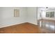Corner view of the light-filled living room with hardwood flooring at 160 Chandler Springs Dr, Holly Springs, NC 27540
