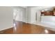 Spacious living room with hardwood floors leading to stairs and kitchen at 160 Chandler Springs Dr, Holly Springs, NC 27540