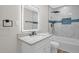 Bathroom featuring a vanity with a modern lit mirror, tile shower, and toilet at 1605 Nixon St, Durham, NC 27707