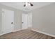Neutral bedroom with new flooring, ceiling fan, and white trim and doors at 1605 Nixon St, Durham, NC 27707