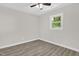 Bright bedroom features new wood flooring and ample natural light from a window at 1605 Nixon St, Durham, NC 27707