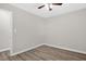 Bedroom featuring wood flooring, a ceiling fan, and fresh, neutral-painted walls at 1605 Nixon St, Durham, NC 27707